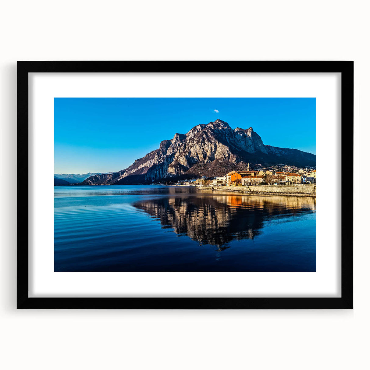 Extra large abstract art print of Lake Como with colorful, textured strokes on a black framed canvas.