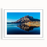 Textured art of Lake Como with abstract water reflections in muted blue shades, framed with a white mat.