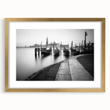 Abstract art print of Venice scenery in muted gold and blue tones on a framed canvas, suitable for dining room decor.