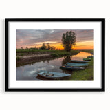 Abstract art print of a colorful, textured European scenery on a large black-framed canvas, ideal for living room decor.