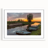 Textured abstract art print of European scenery in muted earth tones, framed with a white mat, suitable for bedroom decor.