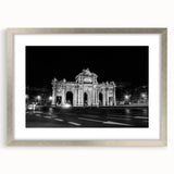 Textured abstract art print of Madrid scenery in muted earth tones, framed in silver, suitable for bedroom decor.