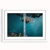 Abstract art print of a European mountain landscape in muted blue and green tones, framed with a white mat.