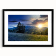 Colorful abstract art print of a European scenery in a black frame, ideal for living room decor.