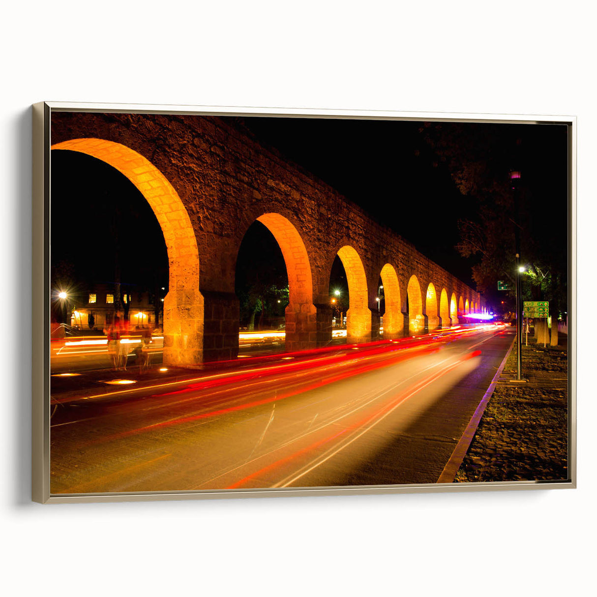 Framed canvas of Mexico City landscape in muted gold and black tones, ideal for bedroom wall art.