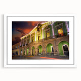 Abstract art print of Yucatan scenery in muted earth tones on a white framed canvas, suitable for dining room decor.