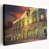 Side view of a large stretched canvas featuring a scenic Yucatan landscape in vibrant green and blue tones.