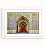 Abstract art print featuring a stylized Middle Eastern landscape in muted earth tones on a framed white mat.