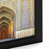 Extra large framed canvas featuring a textured portrayal of a Middle Eastern scenery in black with colorful accents.