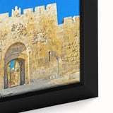 Black wall art featuring a textured depiction of Jerusalem with colorful accents on a framed canvas.