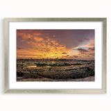 Textured art depicting an abstract Middle Eastern scenery in muted earth tones on a framed silver mat.