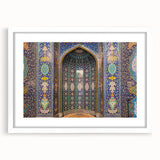 Abstract art print of a Middle Eastern landscape in muted earth tones, framed in white.