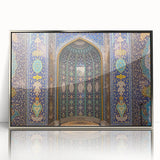 Mid-century modernist art depicting an abstract Oman scenery in muted earth tones on a silver-framed acrylic print.