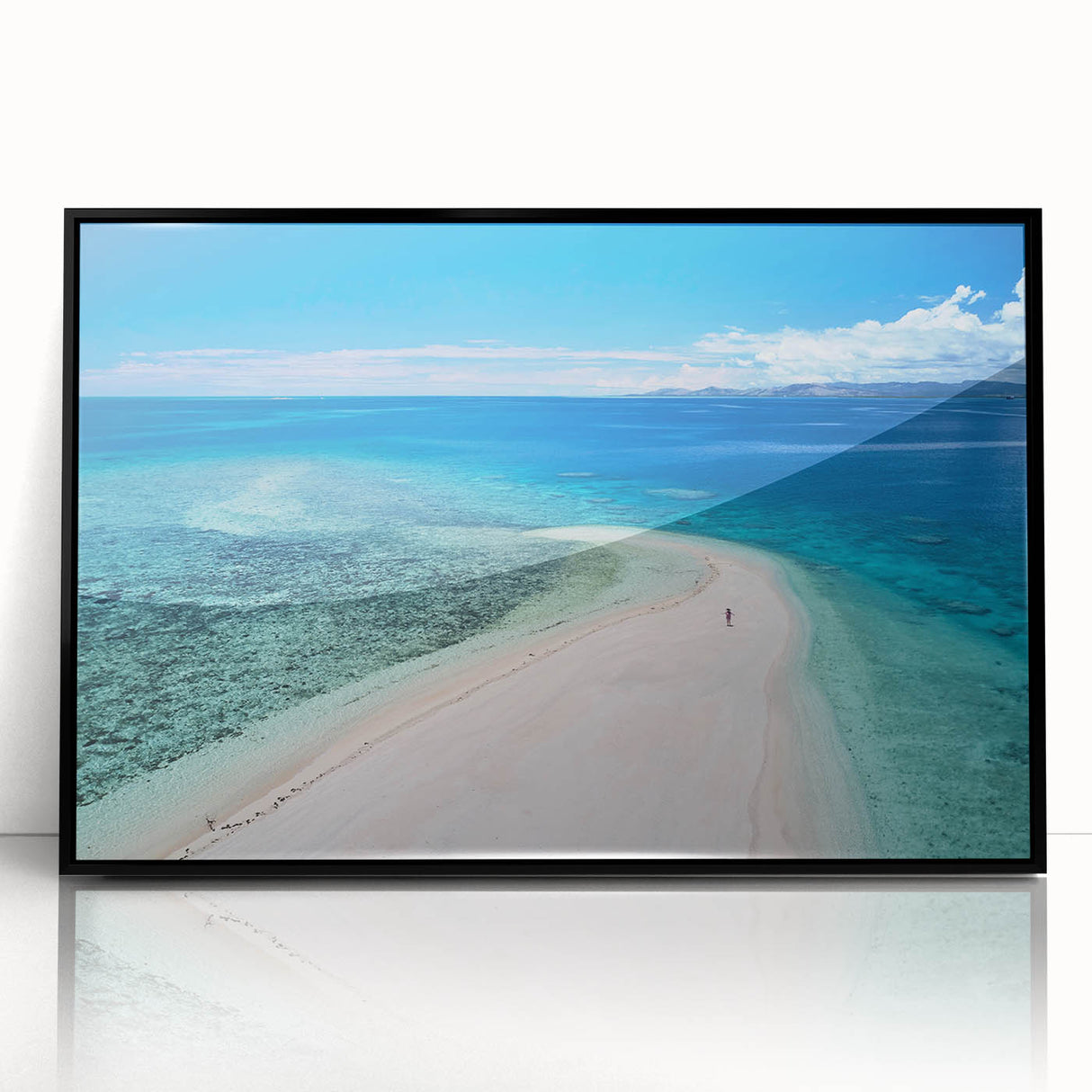 Large abstract wall art depicting an oceanic scene in Fiji with vivid blue and turquoise tones on a black-framed acrylic…
