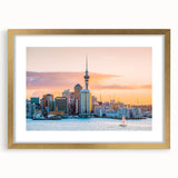 Extra large abstract art print of Auckland skyline in muted blue and gray tones on a gold-framed canvas.