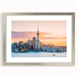 Textured abstract art print depicting the Auckland skyline in muted gray and silver tones on a framed canvas.