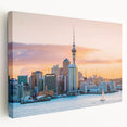 Side view of a stretched canvas depicting Auckland's skyline in muted blue and gray tones, suitable for kitchen wall art.