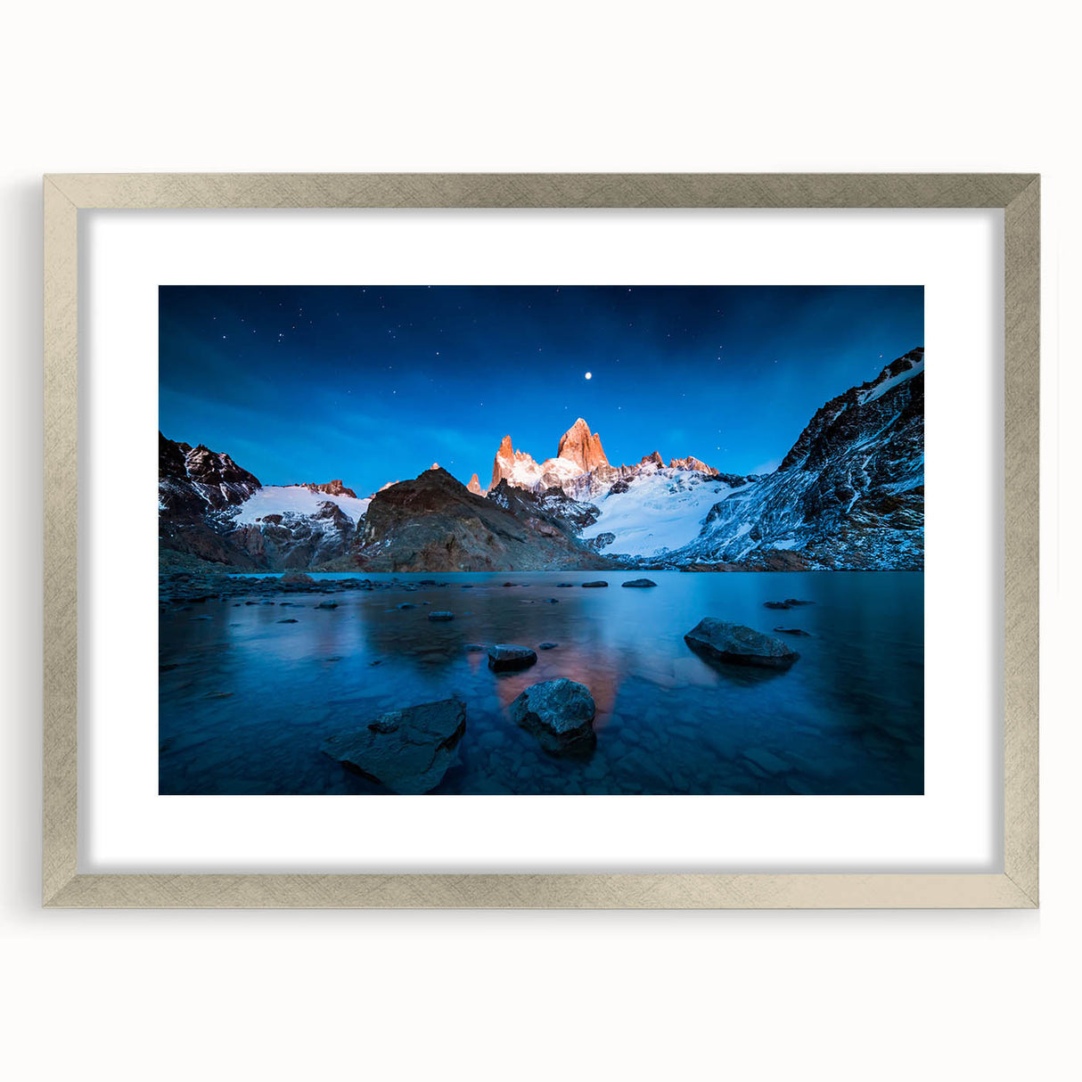 Textured abstract art print of a South American landscape in earth tones, framed in silver, suitable for bedroom decor.