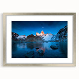 Textured abstract art print of a South American landscape in earth tones, framed in silver, suitable for bedroom decor.
