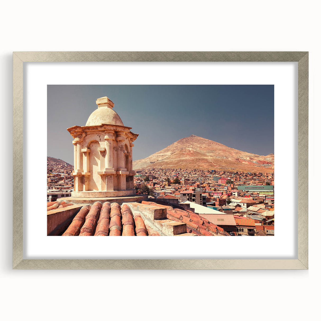 Textured abstract art print of a Bolivian landscape in muted earth tones, framed in silver, ideal for bedroom art.