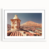 Abstract art print of a Bolivian landscape in muted earth tones on a framed white mat, ideal for dining room decor.