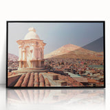 Large abstract wall art depicting a Bolivian landscape in vibrant earth tones, framed in black acrylic.