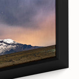 Extra large framed canvas featuring a textured depiction of a South American scenery, with a black background and vibrant.