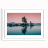 Abstract art print of Lake Tahoe in muted blue and green tones, framed with a white mat, suitable for dining room decor.