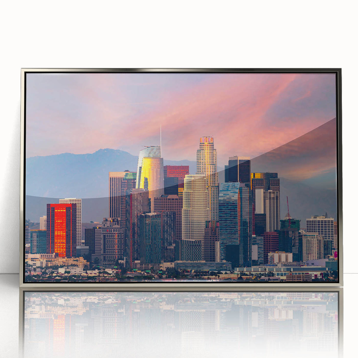 Mid-century modernist art depicting Los Angeles skyline in muted gray tones on a silver-framed acrylic print.
