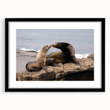 Colorful abstract art print of San Diego landscape in black frame, with textured design, ideal for living room decor.