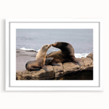 Abstract art print of San Diego skyline in muted blue and gray tones on a framed white mat.