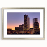 Textured abstract art print of Denver skyline in muted earth tones, framed in silver, ideal for bedroom decor.