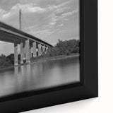 Close-up of a textured black wall art depicting a Delaware scenery on a framed canvas, with colorful accents.