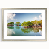 Textured abstract art print of the Florida Keys in muted blue and green, framed in silver, ideal for bedroom wall decor.