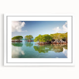 Abstract art print of Florida Keys in muted blue and green tones on a framed white mat, suitable for dining room decor.