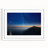 Abstract art print of Lake Michigan in muted blue and gray tones on a white framed canvas.