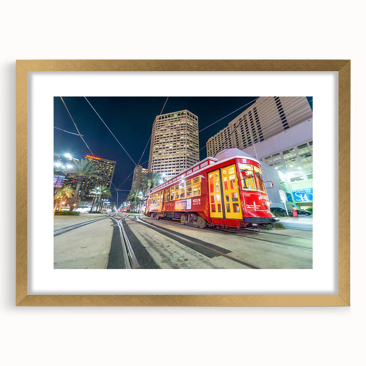 Extra large abstract art print of New Orleans scenery in vibrant colors on a textured canvas, framed in gold.
