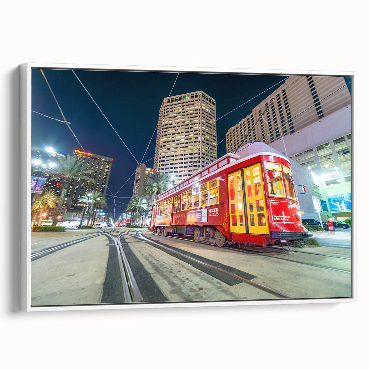 Vintage poster art of New Orleans in vibrant colors on a large framed canvas, ideal for living room decor.