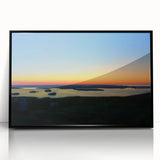 Large abstract wall art depicting Acadia's rugged coastline in muted earth tones on a black framed acrylic print.