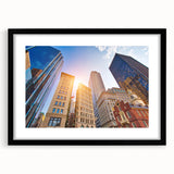 Abstract art print of Boston skyline in colorful, textured strokes on a large black-framed canvas.
