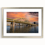 Textured abstract art print of Pittsburgh skyline in muted gray and blue tones on a framed silver mat.