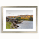 Textured art depicting an abstract landscape in muted earth tones, framed in silver, ideal for bedroom decor.