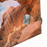 Large abstract depiction of Utah Arches in muted earth tones on acrylic glass, suitable as dining room art.