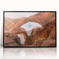 Large abstract wall art depicting Arches National Park in muted earth tones on a black framed acrylic.