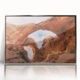 Mid-century modernist art depicting Utah's Arches National Park in earthy tones on a framed acrylic print.