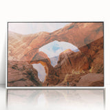 Arches National Park depicted in vibrant orange and blue tones on a white-framed acrylic print.