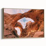 Framed canvas depicting Arches National Park in muted earth tones, ideal for bedroom wall art.