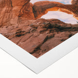 Art deco poster of Arches National Park in muted earth tones on rolled canvas, suitable for dining room wall art.