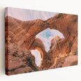 Large canvas print of Arches National Park in Utah, featuring natural stone arch formations in warm earth tones.