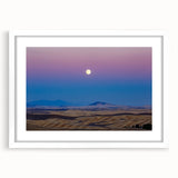 Abstract art print of the Palouse region in muted green and brown tones on a white framed canvas.